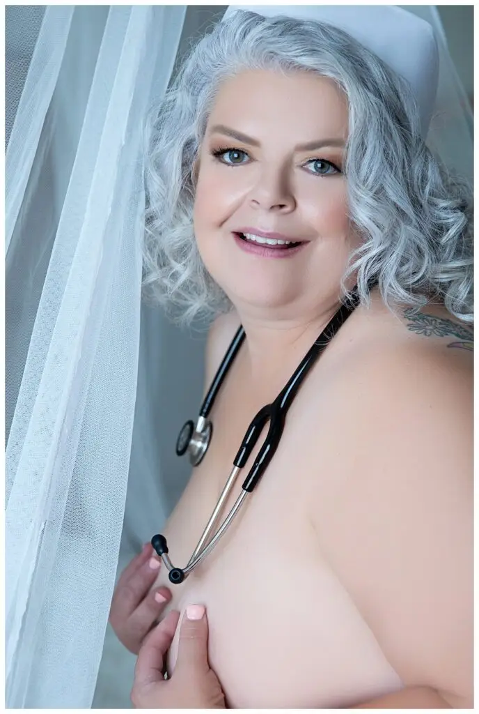 Plus Size Older Woman in Nurse's Costume in Boise's Boudoir Studio, Boudoir Defined.