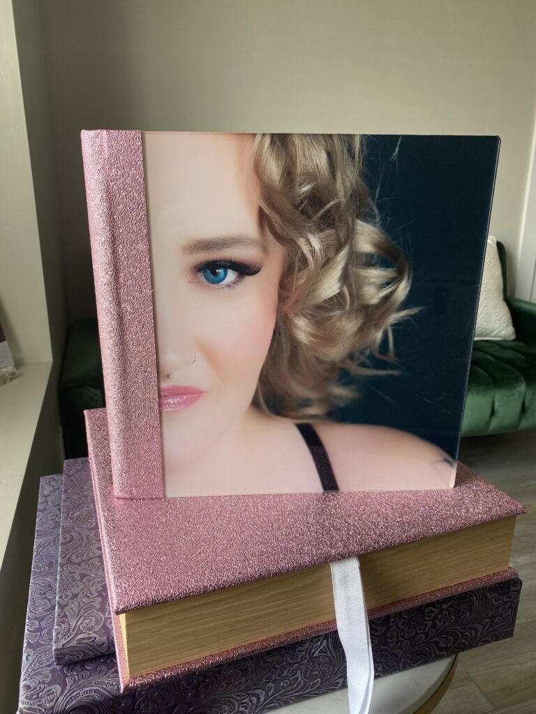 Beautiful 12x12 Album with a sparkly pink cover. The cover image is of a plus-size blond woman.